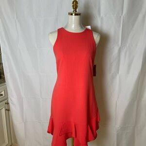 Chic Sleeveless sheath dress with a flirty ruffle skirt detail in Coral. NWT